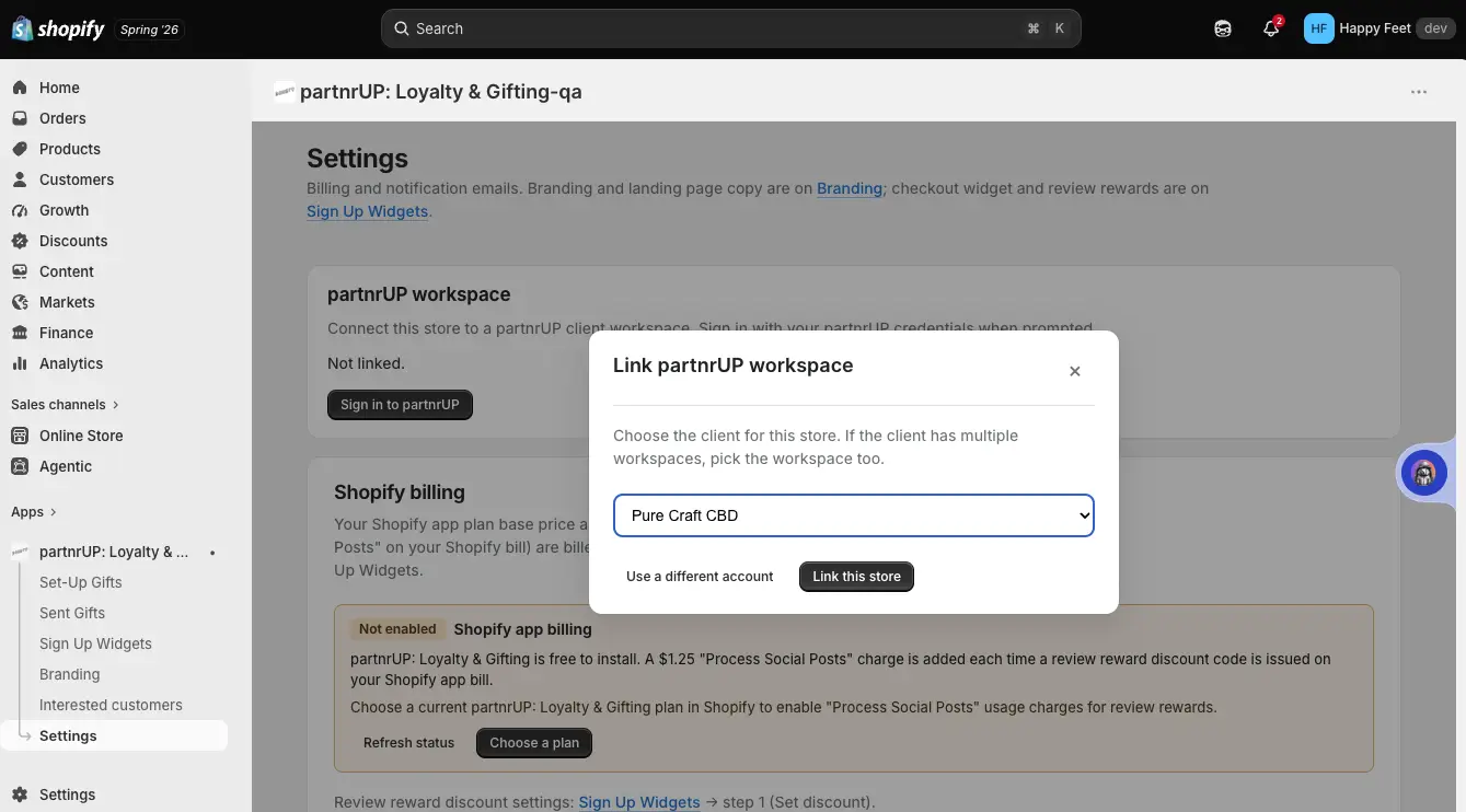Shopify settings page for linking partnrUP workspace with a modal open to select a client.